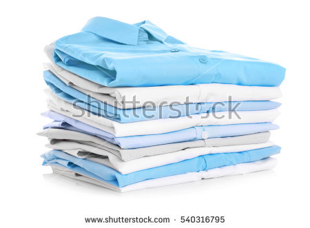 stock-photo-stack-of-clothes-on-white-background-closeup-540316795